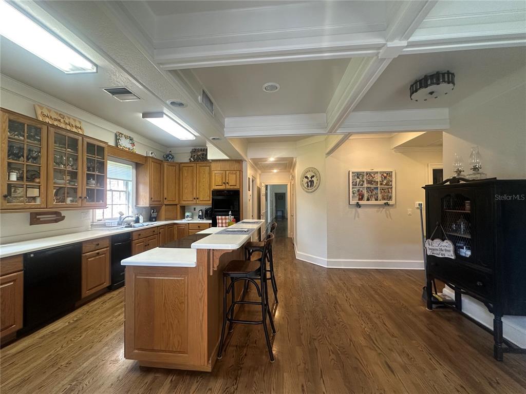 708 East Main Street Wauchula, FL 33873 - Photo 14 of 82 a kitchen with stainless steel appliances a dining table chairs and wooden floor