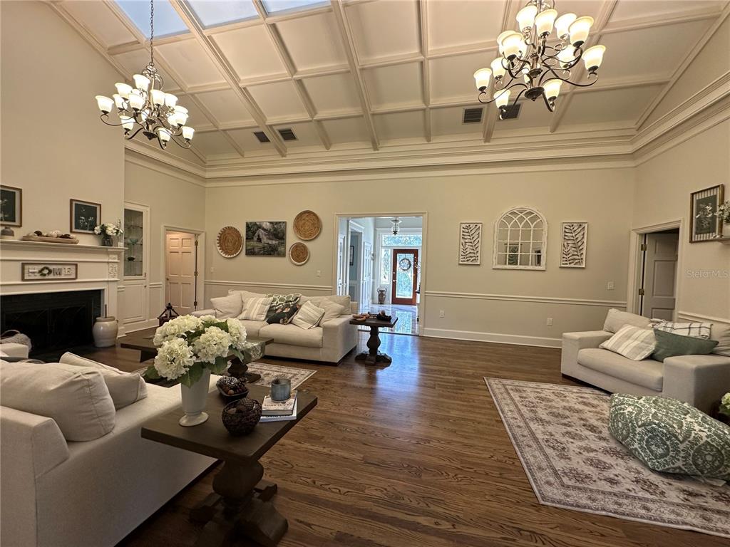 708 East Main Street Wauchula, FL 33873 - Photo 49 of 82 a living room with furniture chandelier and a fireplace