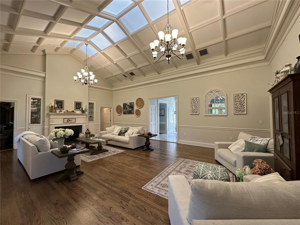 708 East Main Street Wauchula, FL 33873 - Photo 50 of 82 a living room with furniture chandelier and a fireplace