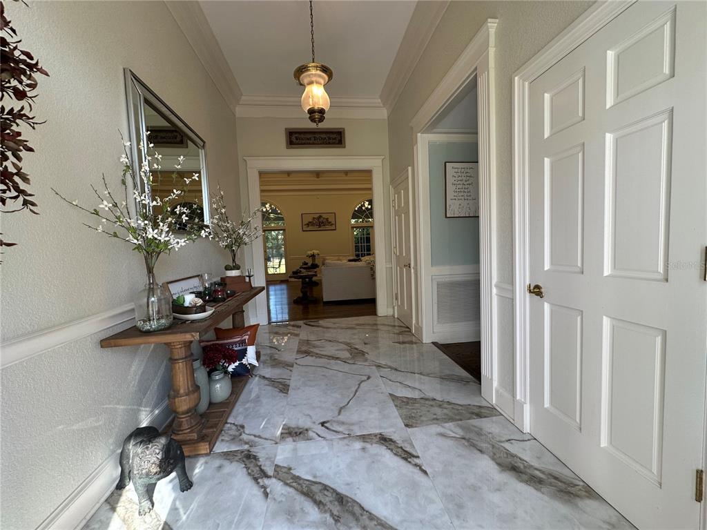 708 East Main Street Wauchula, FL 33873 - Photo 5 of 82 a view of a livingroom with furniture and a hallway