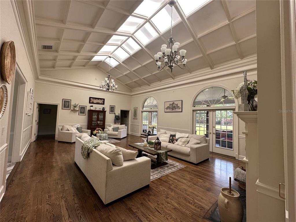 708 East Main Street Wauchula, FL 33873 - Photo 6 of 82 a living room with furniture a chandelier and a fireplace