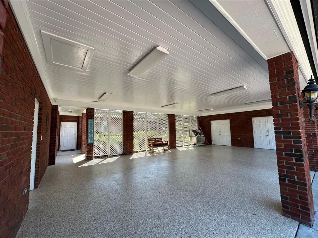 708 East Main Street Wauchula, FL 33873 - Photo 63 of 82 a view of a building stairs and a car parked in garage