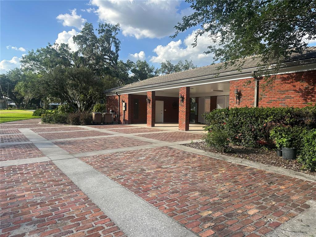 708 East Main Street Wauchula, FL 33873 - Photo 66 of 82 a front view of a house with a yard and potted plants