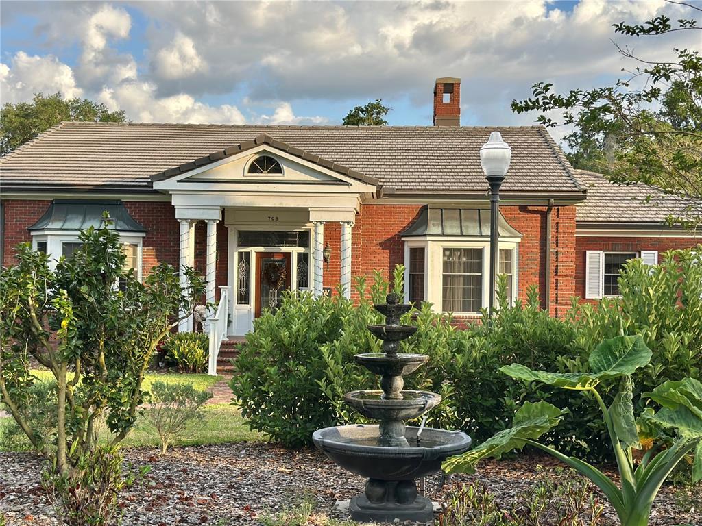 708 East Main Street Wauchula, FL 33873 - Photo 67 of 82 a front view of house with yard and trees in the background