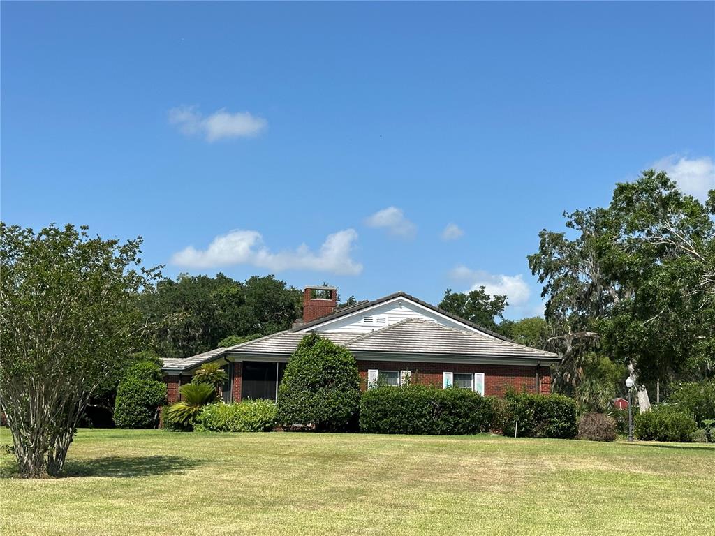708 East Main Street Wauchula, FL 33873 - Photo 78 of 82 a front view of a house with a yard
