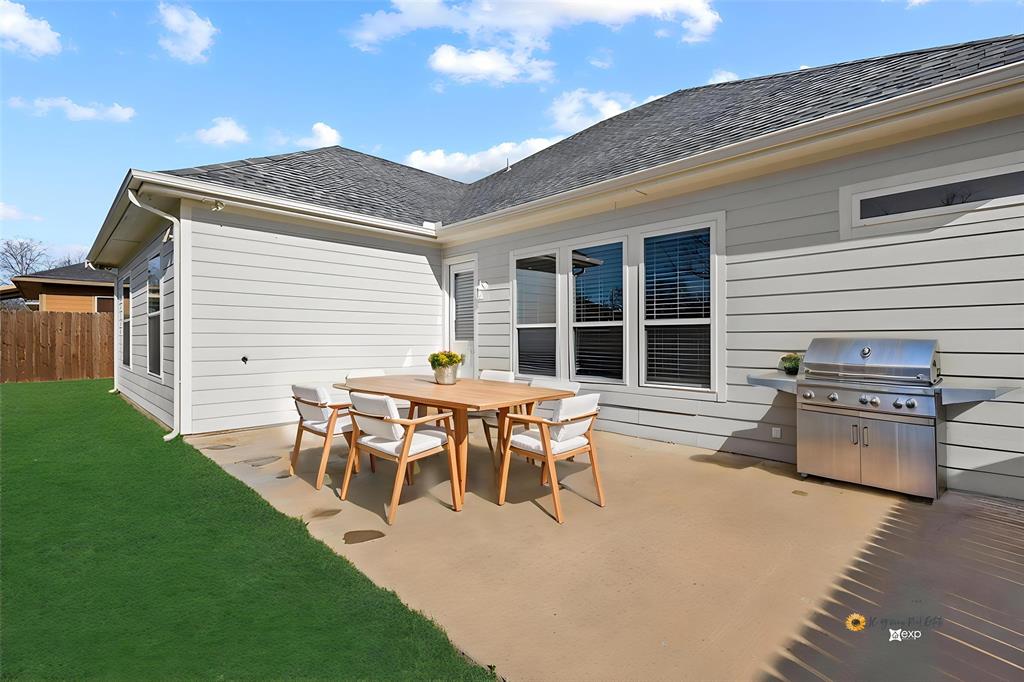 808 East 6th Street Bonham, TX 75418 - Photo 25 of 27 virtually stage but what a large extended patio to enjoy.