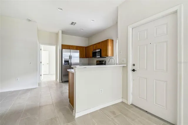 a view of a kitchen with a sink