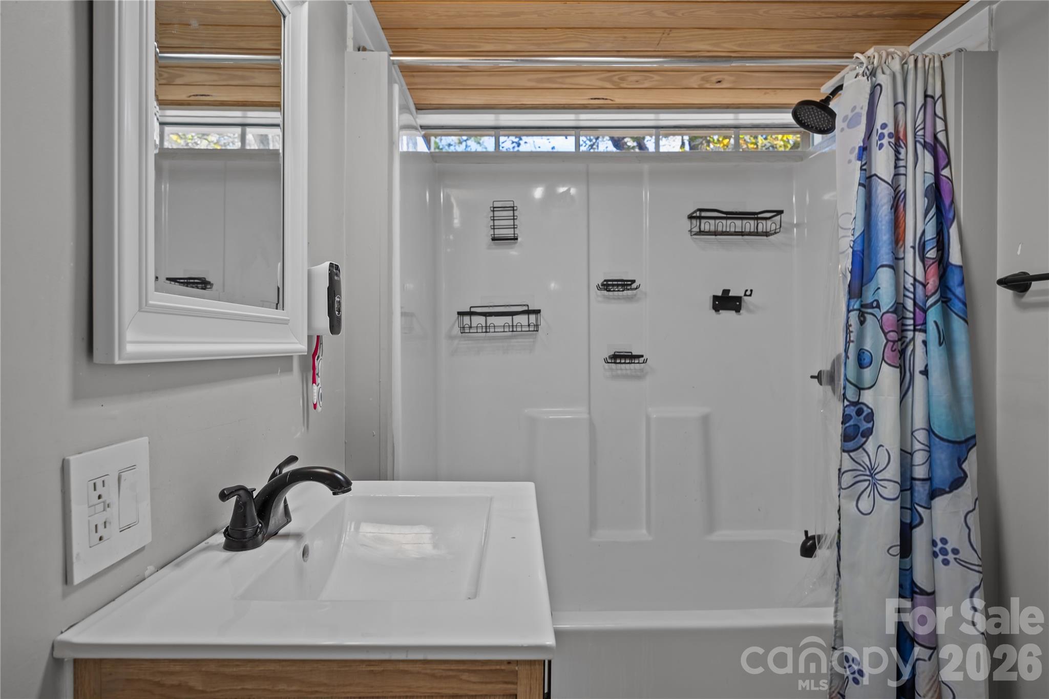 145 Duke Street Cooleemee, NC 27014 - Photo 17 of 27 a bathroom with a sink and a mirror