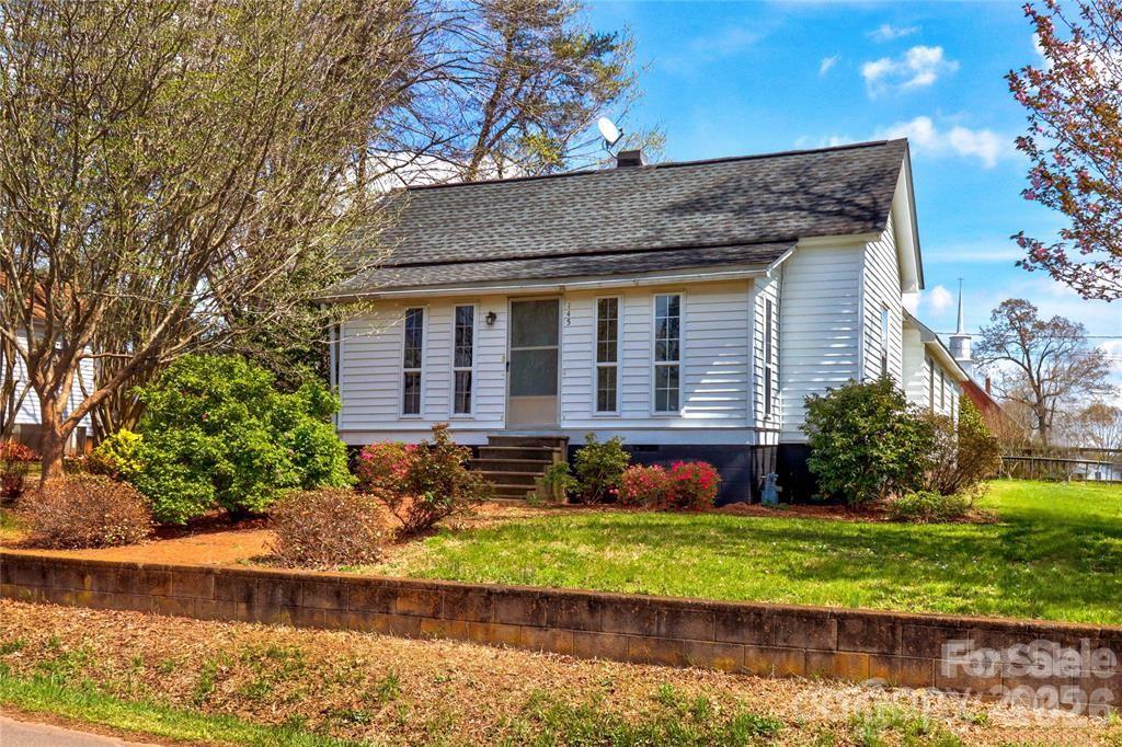 145 Duke Street Cooleemee, NC 27014 - Photo 2 of 27 front view of house with a yard