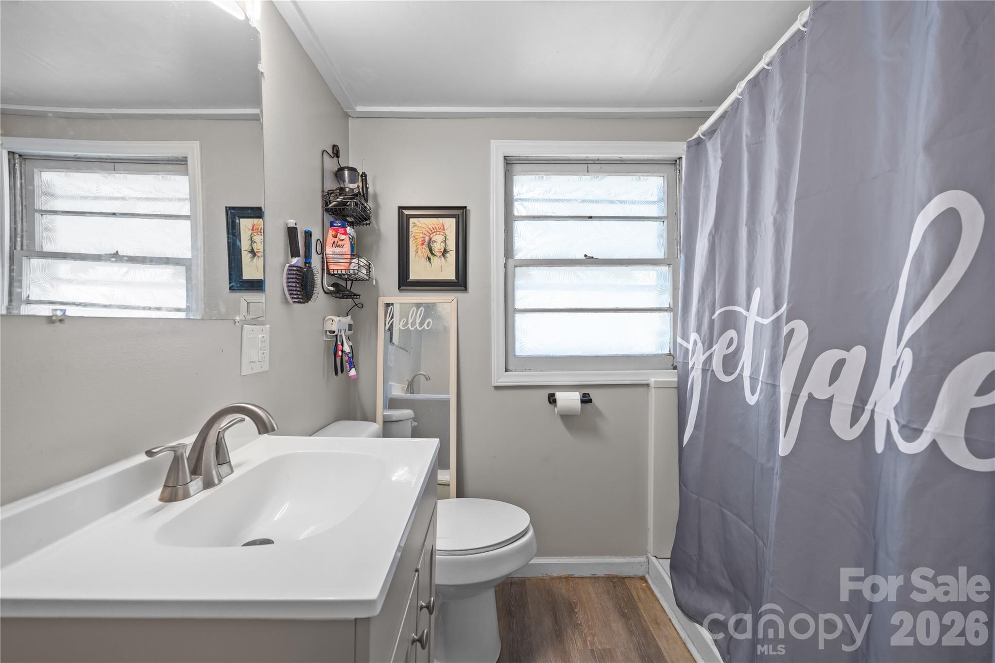 145 Duke Street Cooleemee, NC 27014 - Photo 21 of 27 a bathroom with a sink and a mirror