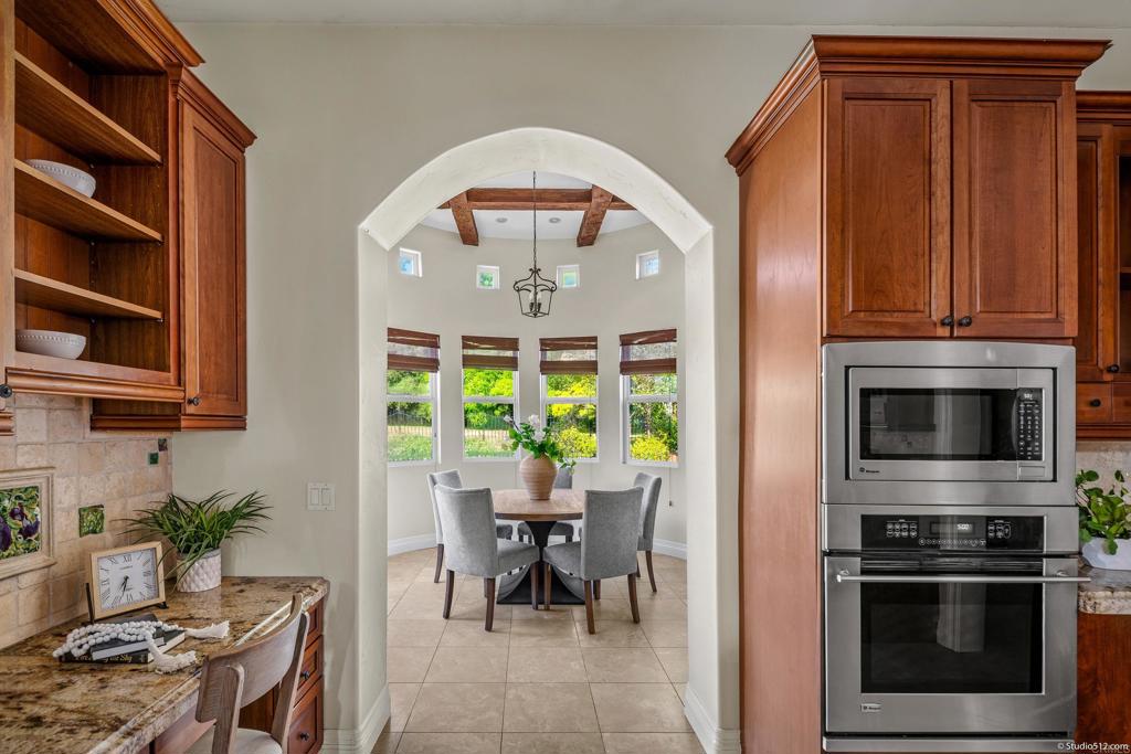 1455 Independence Way Vista, CA 92084 - Photo 11 of 31 a kitchen with stainless steel appliances a stove a sink and a microwave