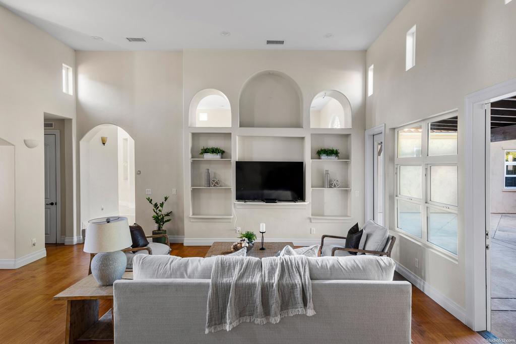 1455 Independence Way Vista, CA 92084 - Photo 14 of 31 a living room with furniture a large window and a flat screen tv