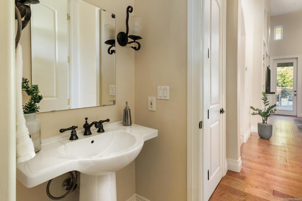 1455 Independence Way Vista, CA 92084 - Photo 16 of 31 a bathroom with a sink and mirror