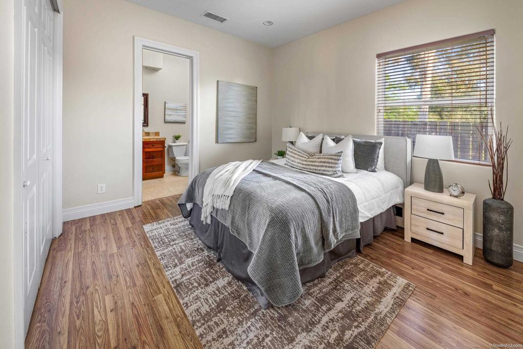 1455 Independence Way Vista, CA 92084 - Photo 22 of 31 a bedroom with a bed and wooden floor