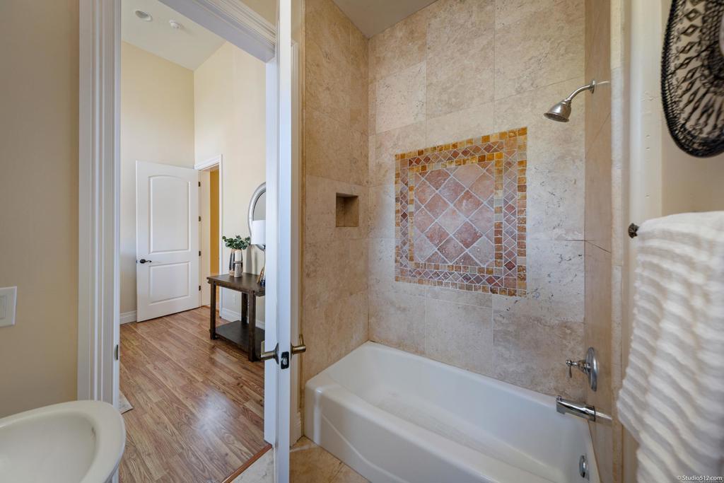 1455 Independence Way Vista, CA 92084 - Photo 23 of 31 a bathroom with a bathtub and a shower