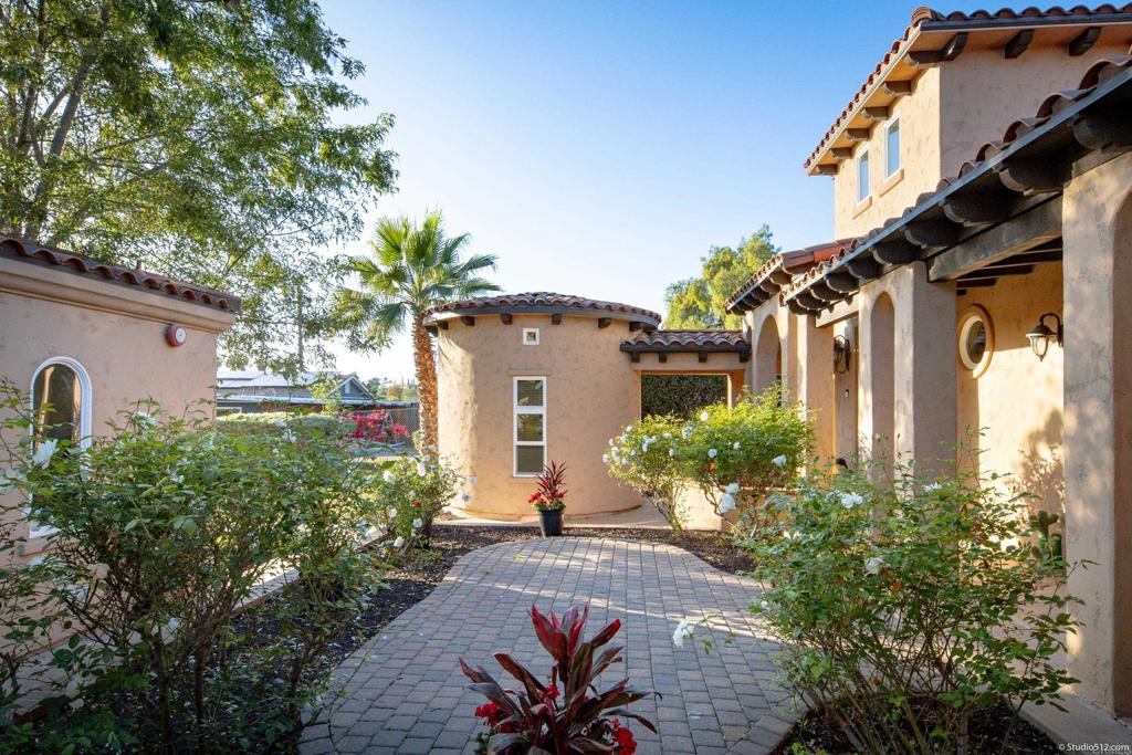 1455 Independence Way Vista, CA 92084 - Photo 28 of 31 a front view of a house with a yard