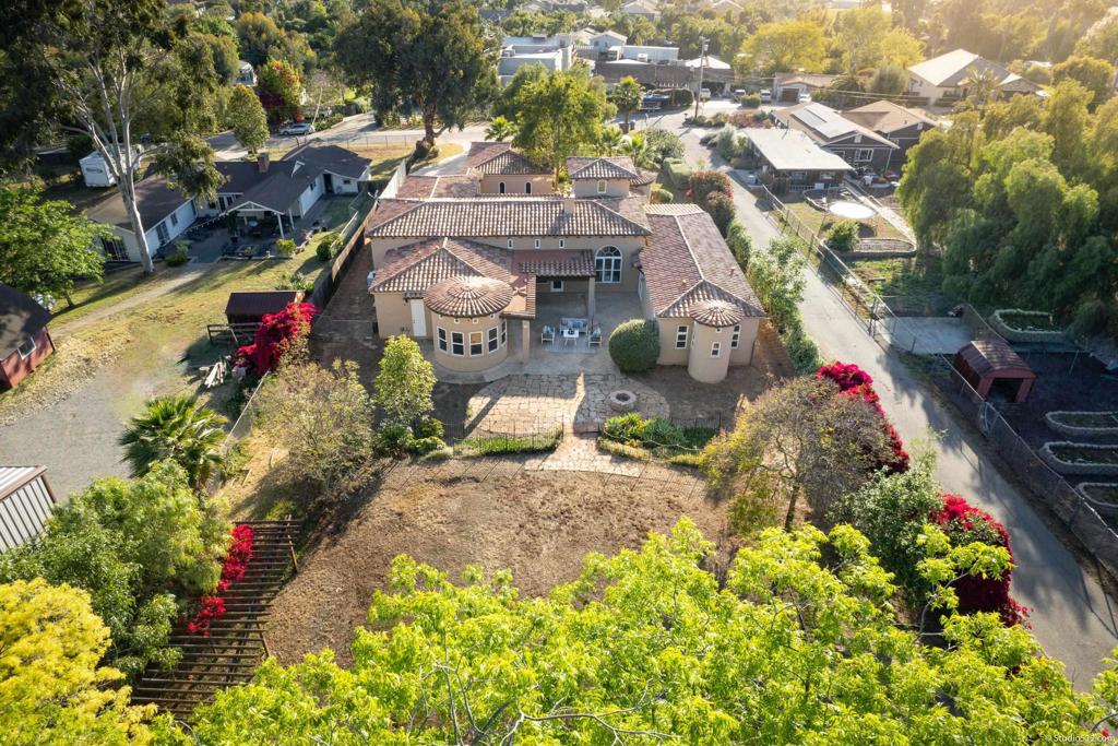 1455 Independence Way Vista, CA 92084 - Photo 30 of 31 an aerial view of a house with a yard and garden