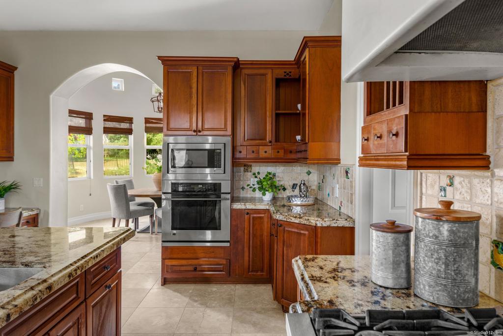 1455 Independence Way Vista, CA 92084 - Photo 10 of 31 a kitchen with a stove and a microwave