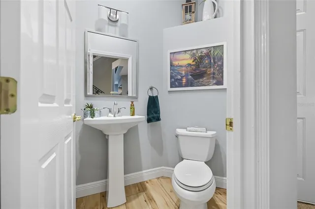 a bedroom with a bed and a view of kitchen