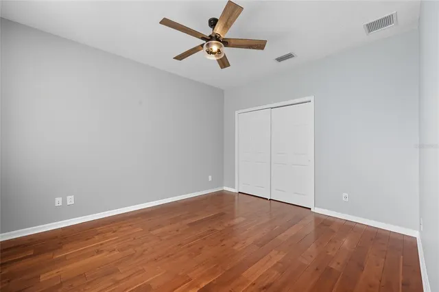 an aerial view of a house with a yard and garden