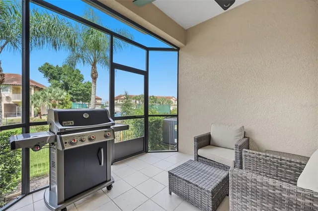 an aerial view of a house with a garden and lake view
