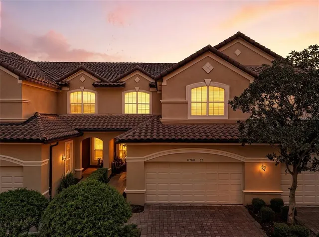 an aerial view of a house with a lake view
