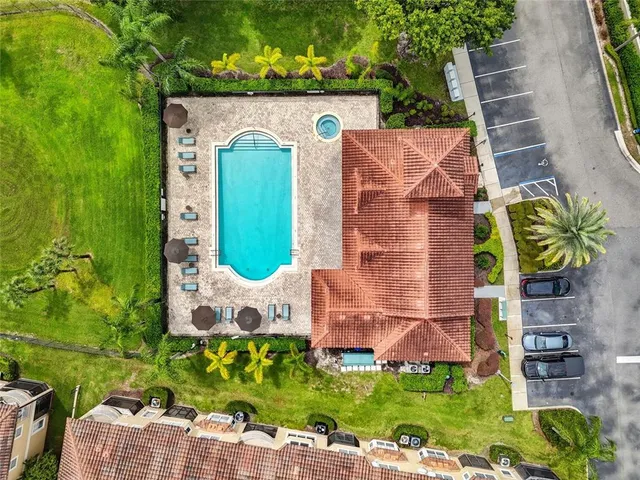 an aerial view of residential houses with outdoor space
