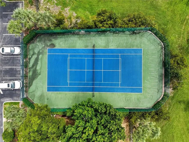 an aerial view of a house with a lake view