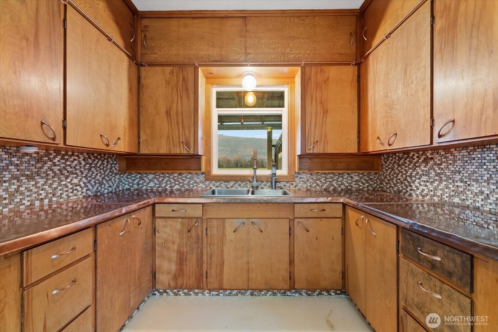 30731 Walberg Road Sedro-Woolley, WA 98284 - Photo 12 of 40 a view of a kitchen with granite countertop cabinets