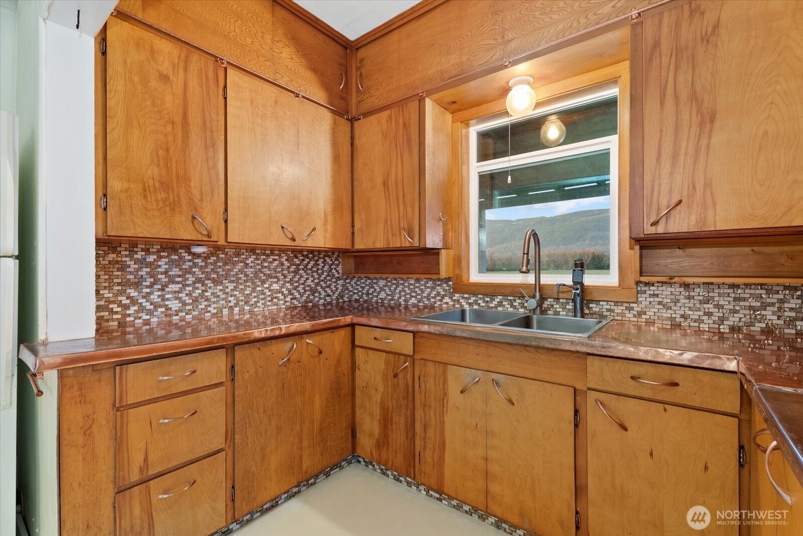 30731 Walberg Road Sedro-Woolley, WA 98284 - Photo 12 of 40 a kitchen with granite countertop white cabinets and sink