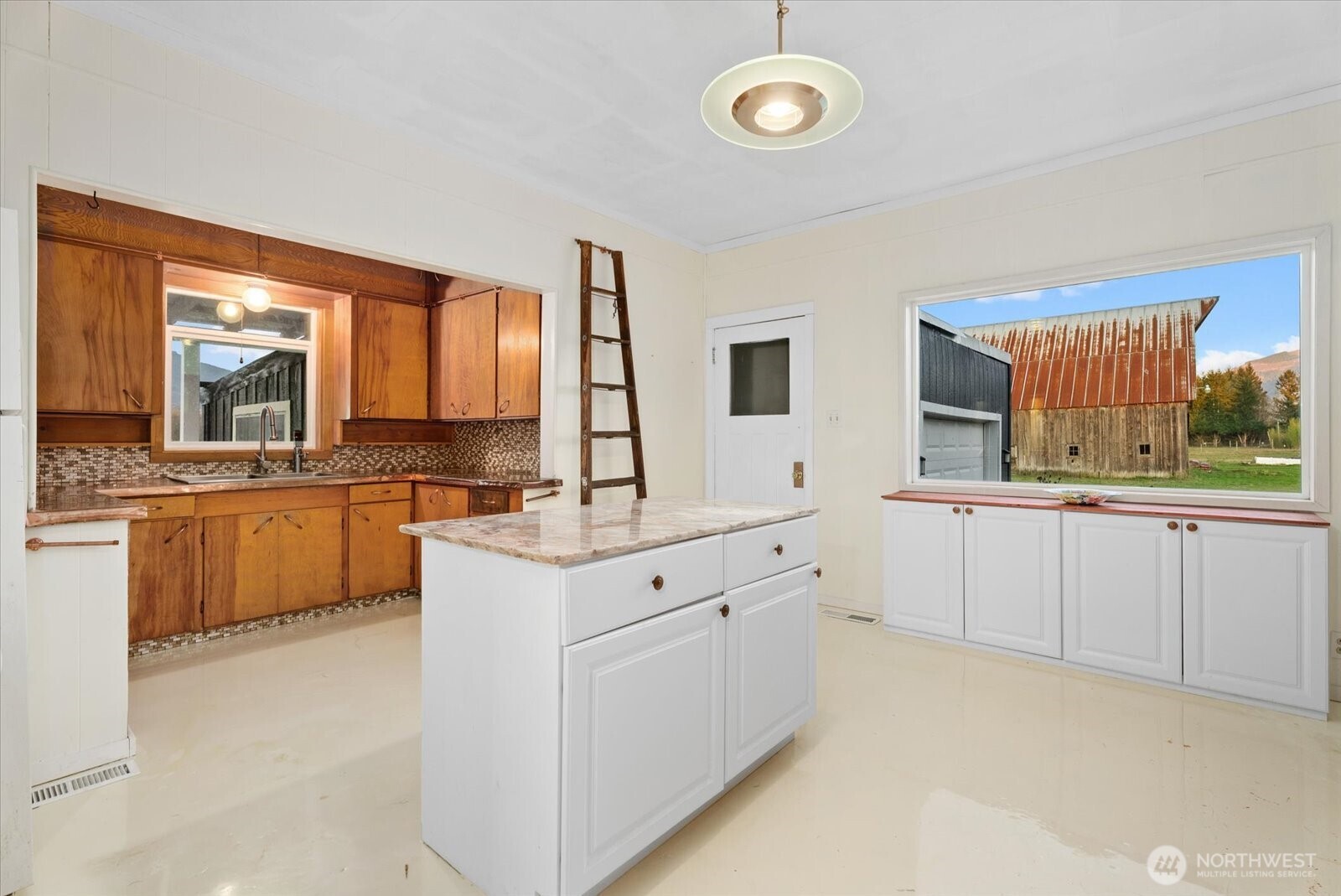 30731 Walberg Road Sedro-Woolley, WA 98284 - Photo 13 of 40 a large white kitchen with cabinets