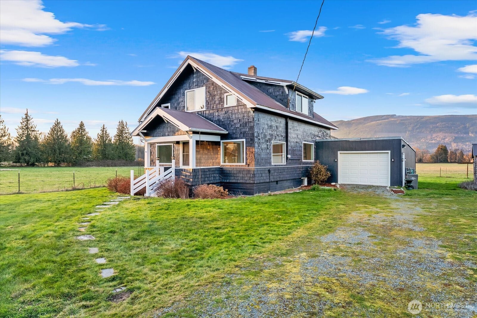 30731 Walberg Road Sedro-Woolley, WA 98284 - Photo 2 of 40 a view of a house with a big yard potted plants and large tree