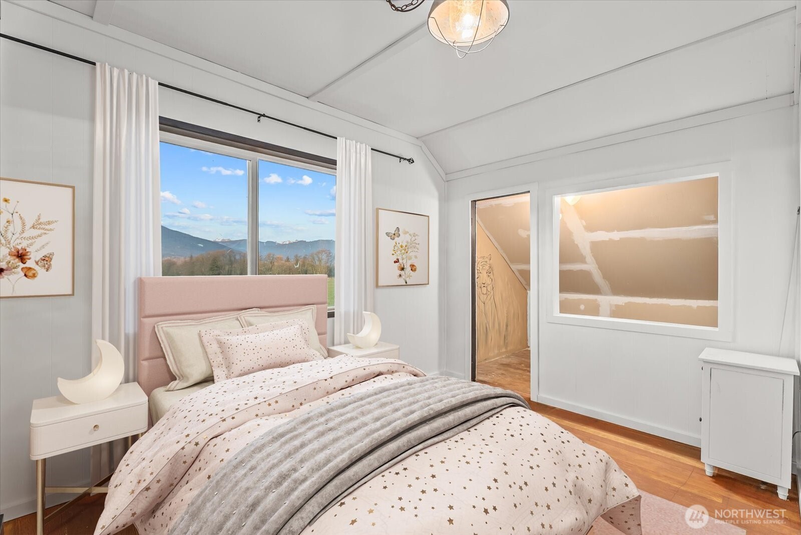 30731 Walberg Road Sedro-Woolley, WA 98284 - Photo 21 of 40 a bedroom with a large bed and a window