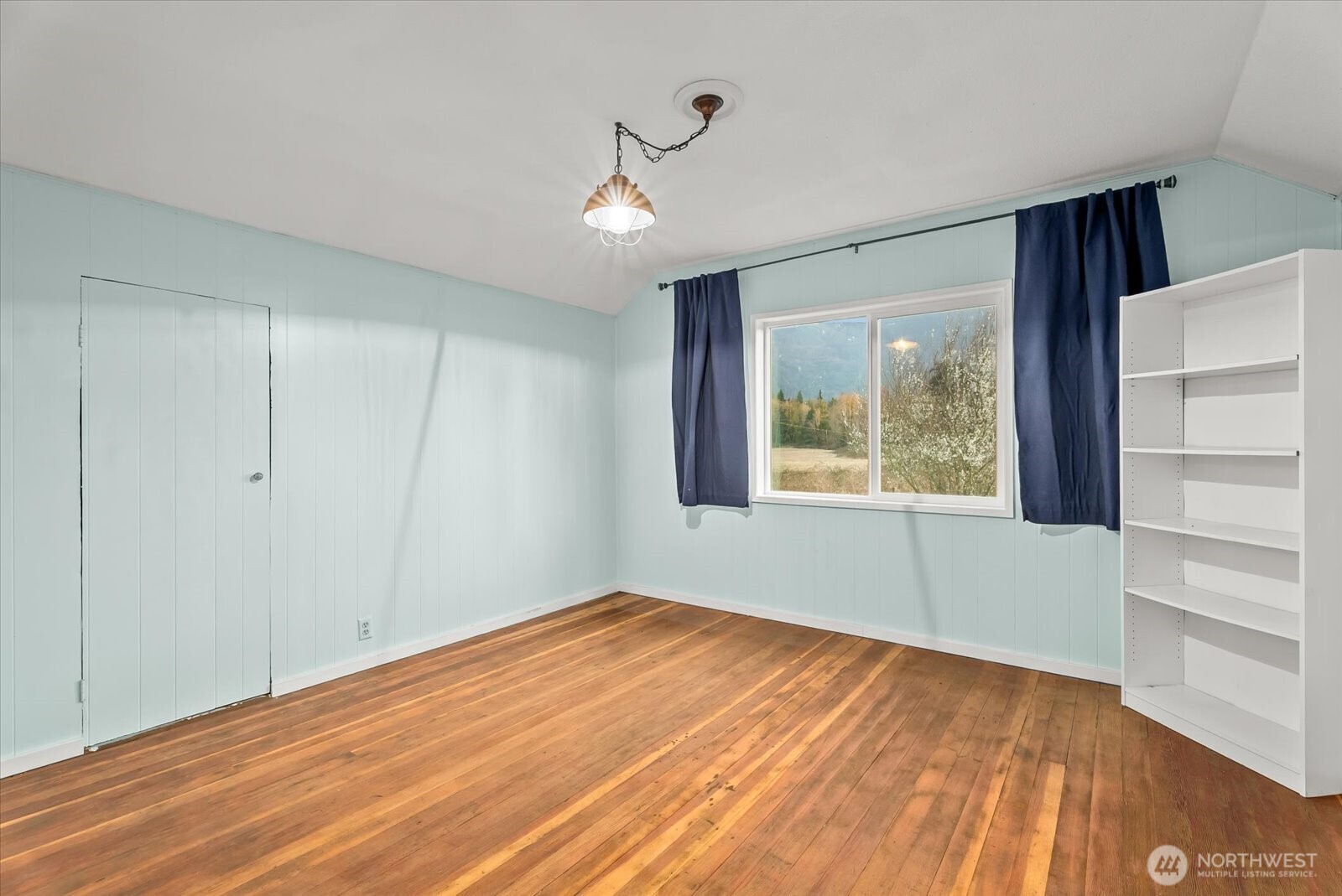 30731 Walberg Road Sedro-Woolley, WA 98284 - Photo 23 of 40 a view of an empty room with wooden floor and a window