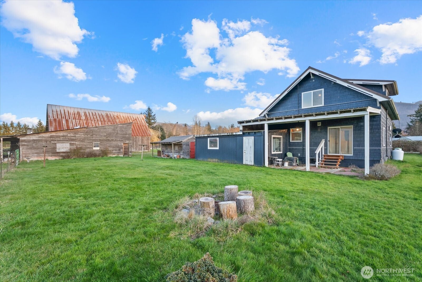 30731 Walberg Road Sedro-Woolley, WA 98284 - Photo 32 of 40 a view of a house with a yard and porch