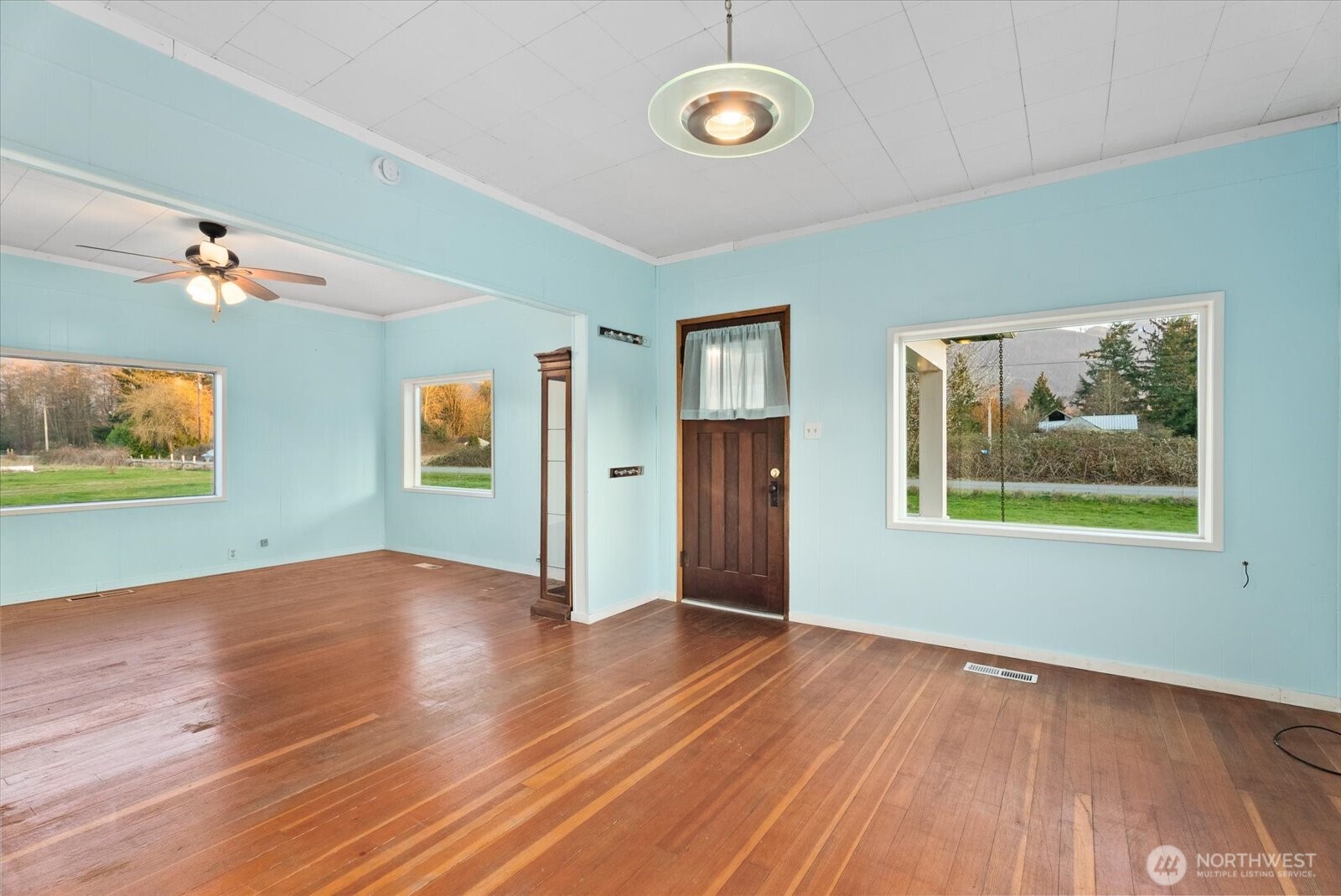 30731 Walberg Road Sedro-Woolley, WA 98284 - Photo 5 of 40 an empty room with wooden floor and window