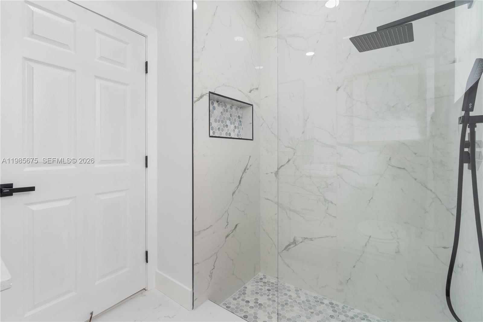 9840 Stover Way Wellington, FL 33414 - Photo 17 of 23 a bathroom with a shower