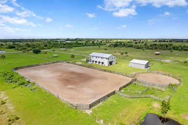 an aerial view of a golf course with a big yard