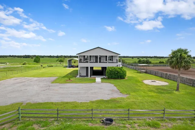 a view of a swimming pool with a yard