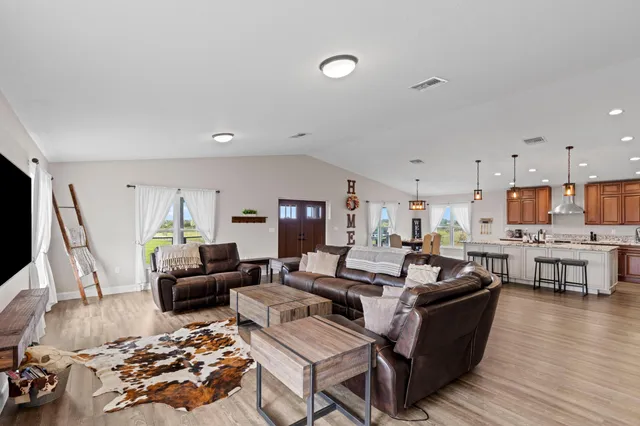 a view of a balcony with wooden floor