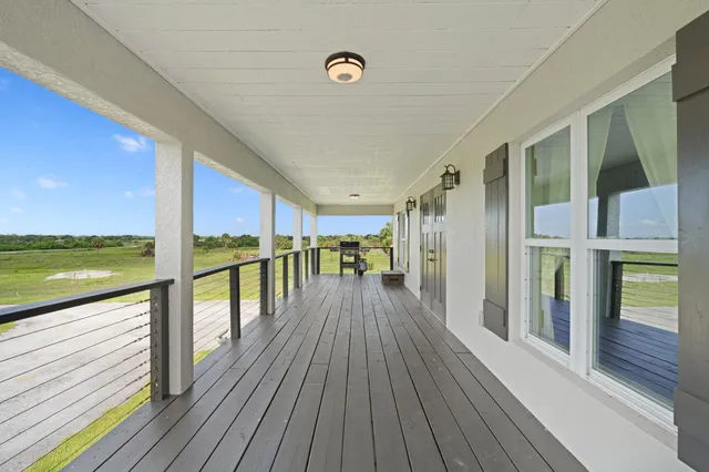 a view of a golf course with a lake view