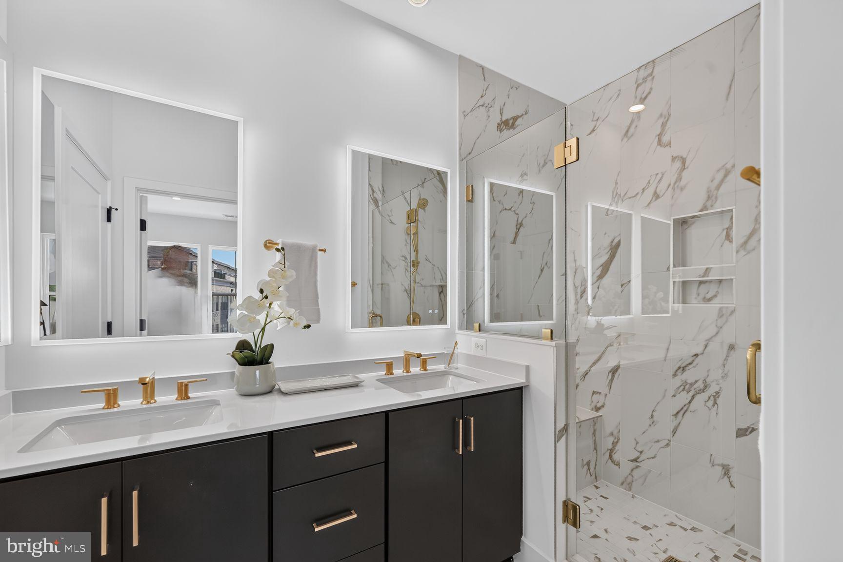 1135 Polaris Road Potomac, MD 20854 - Photo 27 of 37 a bathroom with a double vanity sink mirror and double