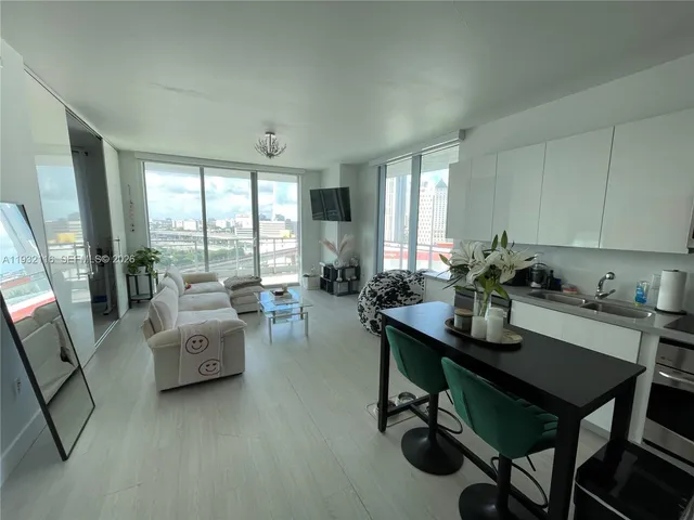 a view of a livingroom with furniture and a table
