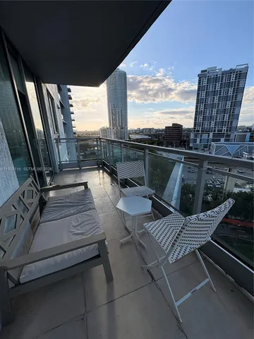 a view of balcony with furniture