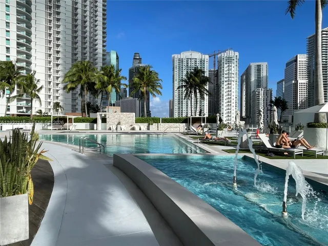 a view of swimming pool with outdoor seating