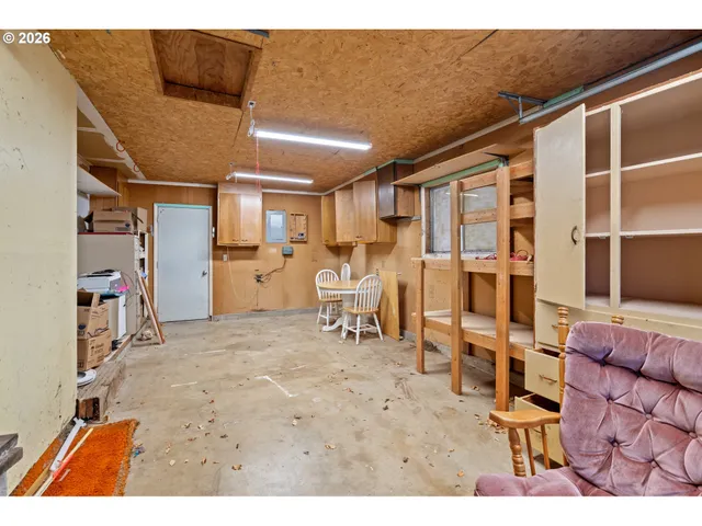 a view of a livingroom with furniture and a window