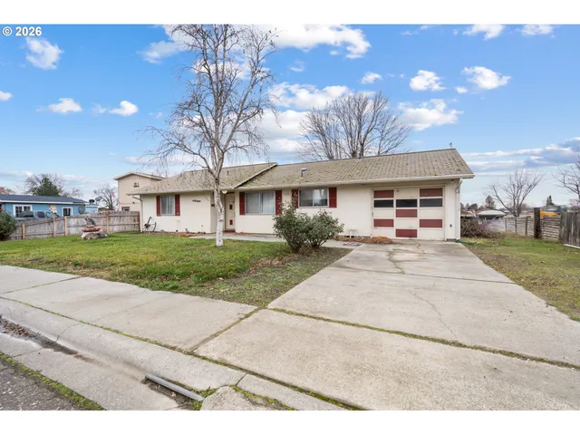 a view of house with yard