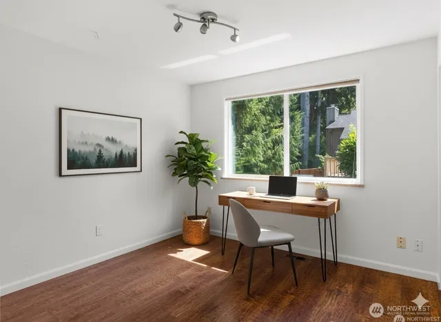 a workspace with furniture and a window
