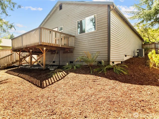 a view of a house with wooden fence