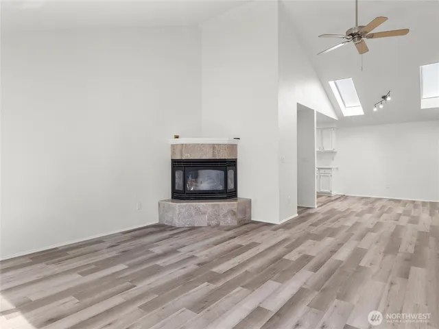 a view of an empty room with a fireplace